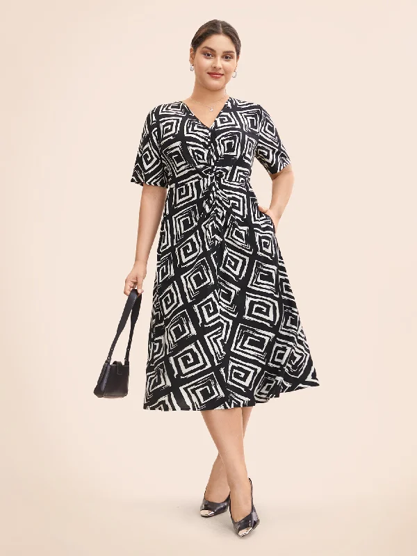 Plus size dresses with unique patterns catch eyes -Geometric Twist Front Midi Dress