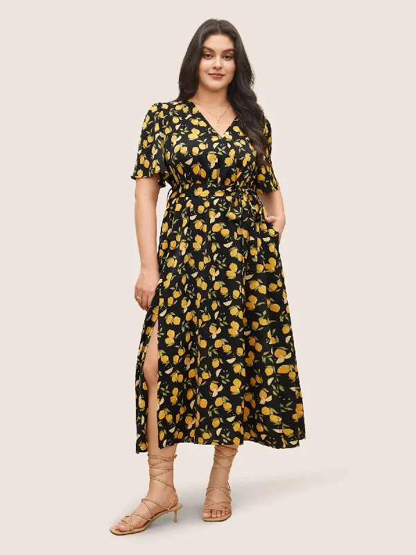 Plus size dresses featuring textured weaves add interest -Citrus Lemons Print Belted Surplice Neck Split Side Dress